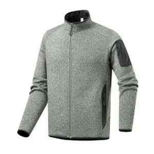 Close-up view of a gray warm polar fleece jacket featuring black zipper pocket detail