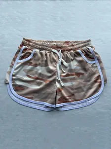 Detailed view of breathable camouflage athletic shorts with drawstring and white piping