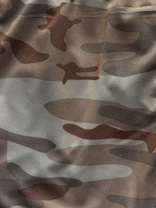 High-definition macro detail of breathable camouflage mesh fabric used for sports shorts