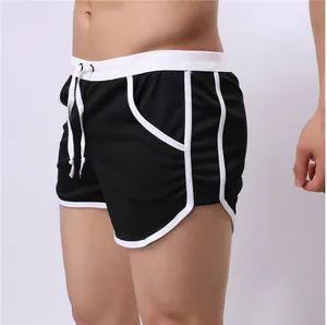 Close-up of black breathable mesh sports shorts for men featuring white trim and drawstring