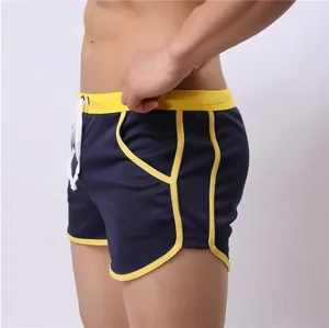 Close-up of navy blue breathable mesh sports shorts with yellow piping details