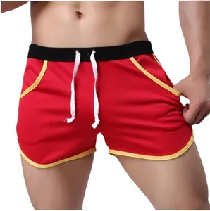 Breathable red men's athletic shorts with yellow trim and white drawstring waist