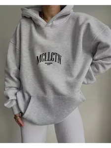 Comfortable women's oversized gray hoodie featuring a front pocket and MCLLCTN letter print detail