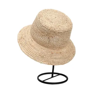 Hand-woven fine Raffia straw sun hat with wide brim, perfect for seaside beach vacations