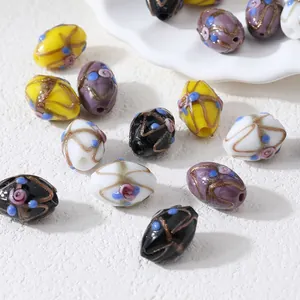 Cuentas de vidrio lampwork artesanales vintage con líneas doradas en forma oval