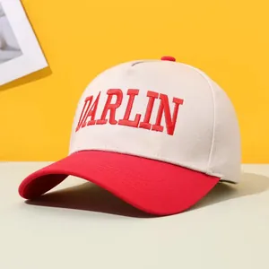 Stylish retro trucker hat featuring red DARLIN embroidery and a two-tone color block design