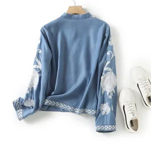Ethnic style loose tencel blue shirt with intricate white floral embroidery and V-neck