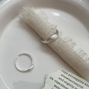Elegant S925 sterling silver minimalist wave ring with brushed texture for women
