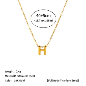 Detailed view of the 18K gold stainless steel necklace featuring a bold H letter pendant
