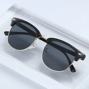 Classic semi-rimless Clubmaster style sunglasses with silver rivets and gold metal trim