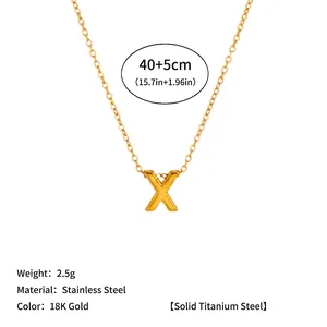 Detailed macro view of 18K gold-plated stainless steel 'X' letter pendant necklace
