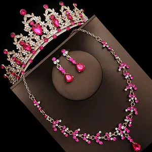 Detailed view of elegant pink crystal bridal luxury crown, necklace and earrings set.