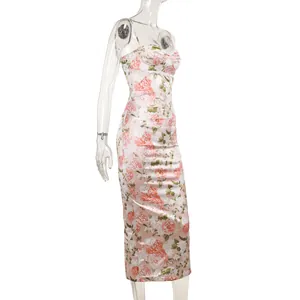 Side view of elegant pink floral satin slip dress with slim fit fishtail hemline.