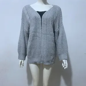 Detail view of grey chunky knit cardigan on mannequin with loose fit texture