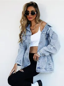 Stylish oversized distressed light blue denim jacket with ripped details for women.