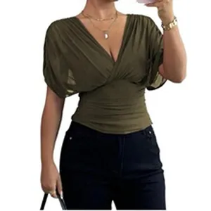 Detail view of olive green women's V-neck ruched waist blouse with elegant pleated texture