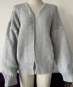 Detailed view of a grey loose knit cardigan for women, perfect for fall and winter seasons