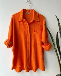 Detailed macro view showing the texture of an orange crinkle cloth long-sleeved shirt