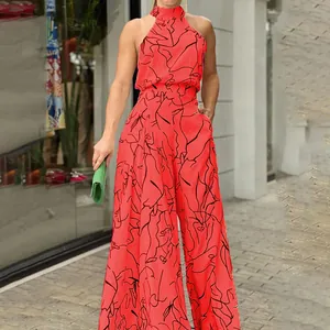 Tuta intera con scollo all'americana rosso-arancio con stampa artistica nera