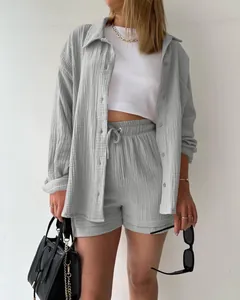 Close-up of casual two-piece set featuring crinkle fabric shirt and drawstring shorts