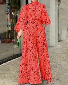 Tuta intera arancione a maniche lunghe da donna con stampa astratta a linee nere