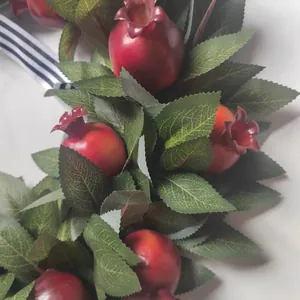 Artificial fall pomegranate wreath with realistic green leaves and striped ribbon decor