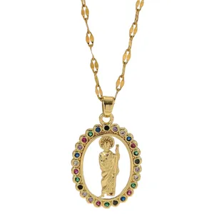 Gold oval pendant necklace with religious saint figure and multi-colored zircons