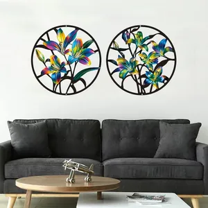 Colorful metal flower wall art set displayed on a living room wall above a modern grey sofa