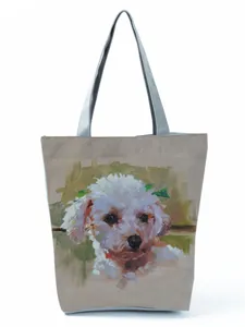 Detailed view of the artistic oil painting poodle print on a canvas tote bag