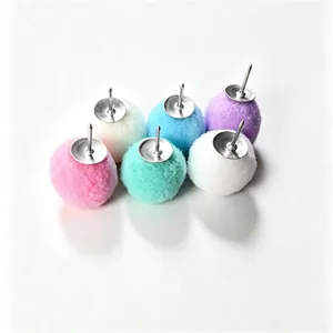 Close-up of colorful decorative pom-pom push pins for office boards