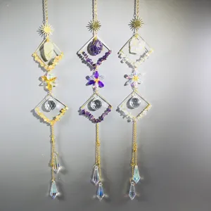 Close-up of three suncatchers with natural raw crystals and faceted crystal balls