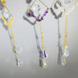 Detailed view of handmade amethyst suncatcher with gold chain and faceted crystal pendants