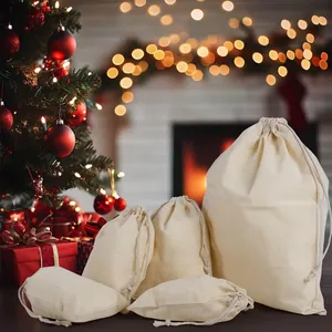 Set of natural cotton drawstring bags for Christmas gift packaging and storage.