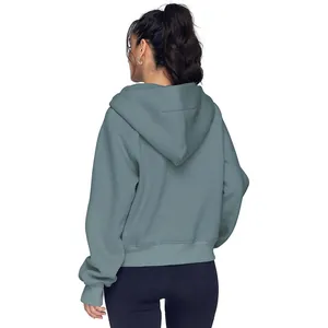 Vue arrière d'un sweat à capuche épais bleu sarcelle pour femme, idéal pour l'automne.