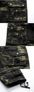 Detailed view of multi-pocket design on camouflage cargo shorts with durable metal snaps