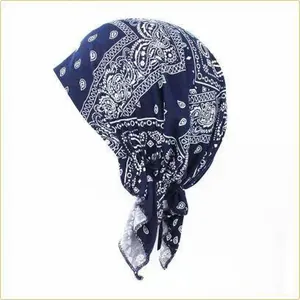 Detail view of navy blue paisley print turban headscarf for women, lightweight accessory.