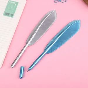 Detail shot of blue and silver metallic feather gel pens with 0.5mm needle tip on pink background