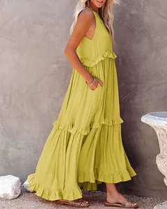 Elegant mustard yellow tiered maxi dress with feminine ruffle details shown from side view