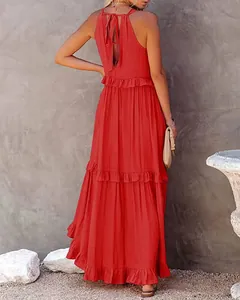 Back view of a red tiered maxi dress with halter neck and tie-back ruffles
