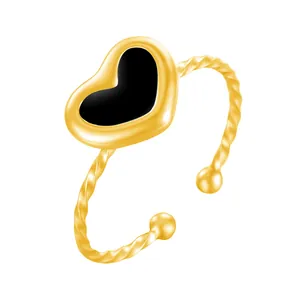 Elegant gold-plated stainless steel twisted band ring with black enamel heart charm
