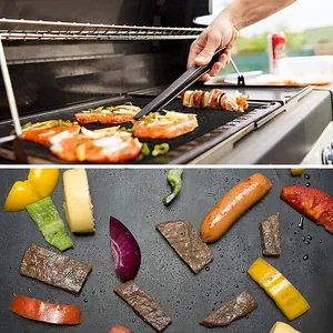 Close-up of non-stick black Teflon BBQ grill mat with grilled meat and vegetables.