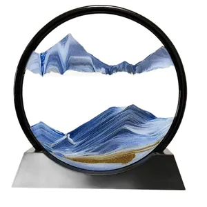 Elegant circular moving sand art with a blue mountain landscape on a black base