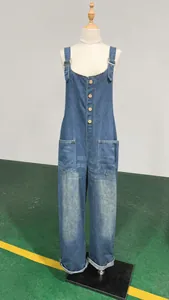 Front view of women's vintage washed blue denim overalls displayed on a mannequin.