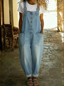 Vintage light blue washed denim overalls for women featuring a loose and oversized fit.