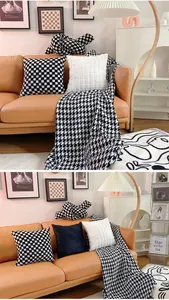 Cozy living room detail featuring plush checkerboard pillows and a houndstooth throw