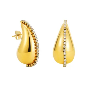 Detailed macro shot of 18K gold plated chubby teardrop earrings with zirconia inlay.
