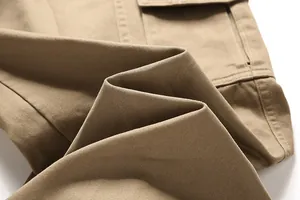 Close-up of khaki pure cotton cargo pants showing twill fabric texture and stitching detail