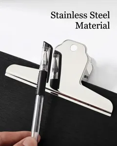Detailed view of a stainless steel mountain clip holding a pen on a black board