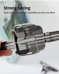 Macro view of the durable metal spring mechanism on a stainless steel mountain clip