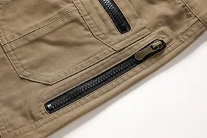Macro shot showing the high-quality zipper and reinforced stitching on men's cotton cargo pants